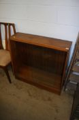 Set of six teak dining chairs and a sliding door bookcase