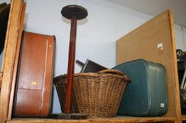 A shelf of miscellaneous; suitcase, wicker basket etc.