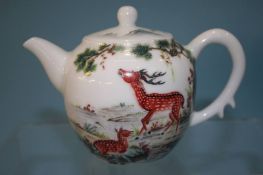 A Famille Rose miniature tea pot. 10cm tall
