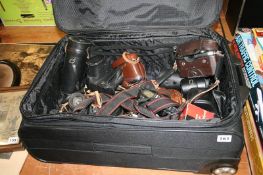 A suitcase of cameras and accessories