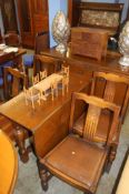 An oak six piece dining room suite