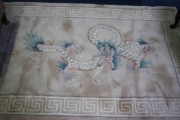 A cream Chinese style rug