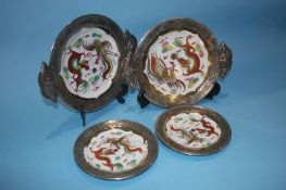 A set of 12 silver mounted Famille Rose plates