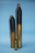 Three brass ordnance shells