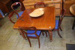 A mahogany extending dining table and a set of five chairs