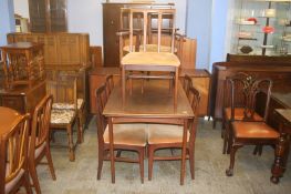 A Youngers Afromosia dining room suite comprising; sideboard, drawer leaf table and six chairs