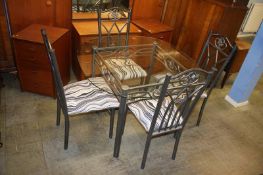 Glass top kitchen table and four metalwork chairs