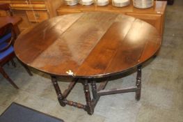 An oak gateleg dining table