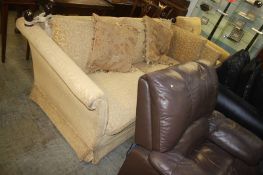 A yellow patterned three seater Knoll style settee and armchair