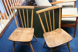 A pair of Ercol stick back chairs and a bridge table