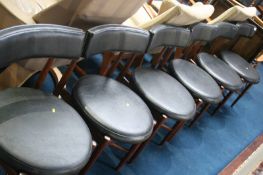 A set of six G Plan teak chairs, with vinyl black circular seats and curved splat