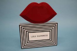 Red perspex ‘Stacked Lips’ clutch bag from Lulu Guinness, with dust bag and box