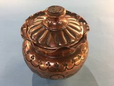 A copper Arts and Crafts tobacco jar