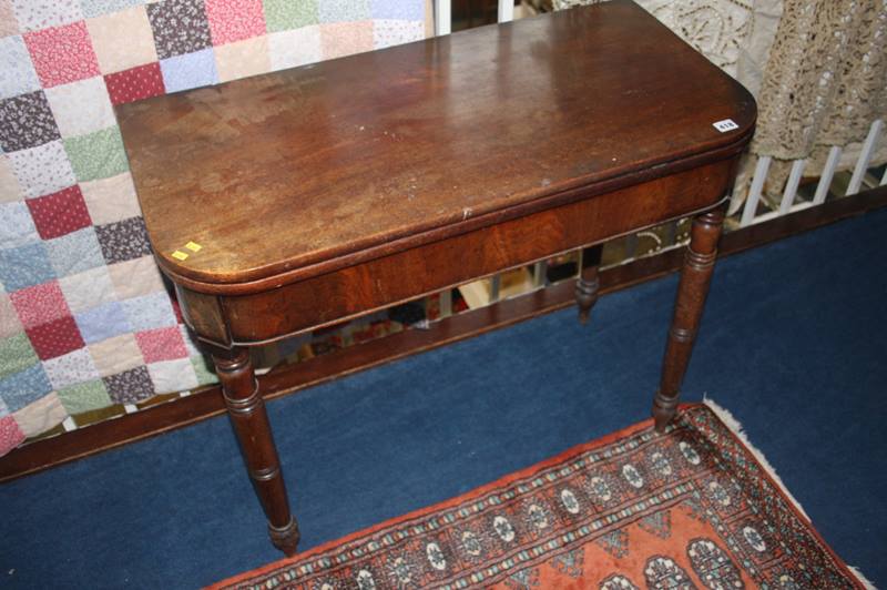 A 19th century mahogany fold over tea table