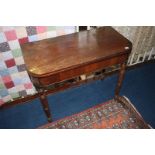 A 19th century mahogany fold over tea table