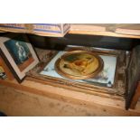 A shelf of framed pictures