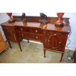 A mahogany breakfront sideboard