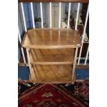 An Ercol Golden Dawn three tier tea trolley