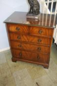 A reproduction mahogany chest of drawers