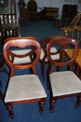 A set of four Victorian balloon back chairs