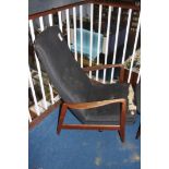 A teak framed armchair by Folke Ohlsson and a matching footstool