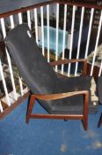 A teak framed armchair by Folke Ohlsson and a matching footstool