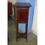 An Edwardian mahogany bedside cabinet