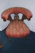 A Victorian walnut tub armchair