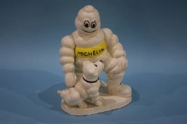 A cast model of a Michelin man with his dog