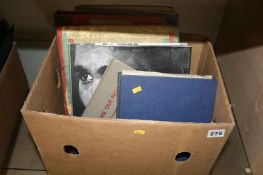 A box of scrapbooks and related books on boxing