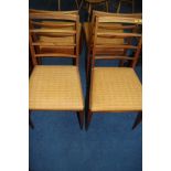 A set of four teak McIntosh ladder back chairs
