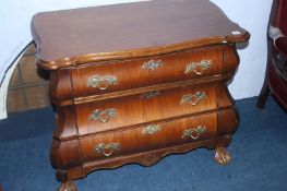 A small Continental oak bombe chest of three long drawers