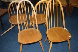 A set of four Ercol hoop back chairs