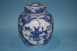 A Chinese blue and white ginger jar and cover and a Chinese blue and white baluster shaped vase