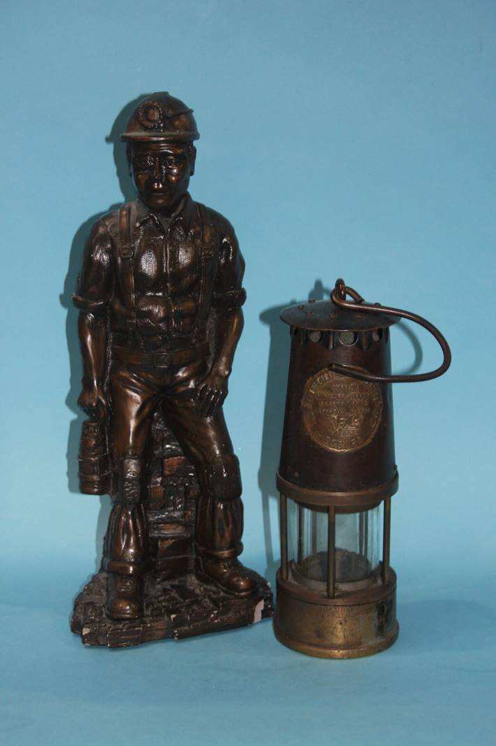 Coal mining figure and a miners lamp