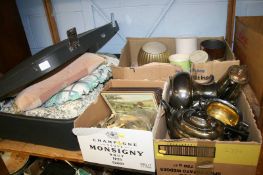 A shelf of assorted, plated items, cushions etc.