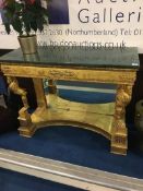 A marble top and gilt console table