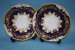 A pair of Coalport plates, a pair of Caverswall plates, a Copeland water jug and a Spode Italian