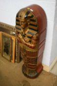 A stack of shelves in the shape of an Egyptian sarcophagus