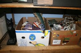 A shelf of assorted, religious icons etc.