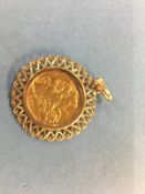 A half sovereign, dated 1911 in 9ct mount, total weight 5.2g