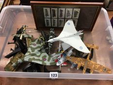 A selection of Die Cast military aircraft and framed cigarette cards