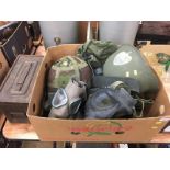 A box of militaria to include US army helmet etc.