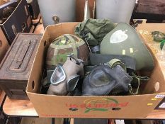 A box of militaria to include US army helmet etc.