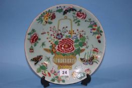 A Chinese canton enamel wall plate, marks in underglaze blue, 26cm diameter