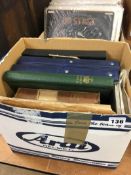 A box of stamp albums and covers etc.