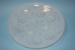 A French opalescent shallow glass bowl decorated with six flowerheads, stamped Made in France,