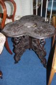 A Maple and Company carved trefoil occasional table