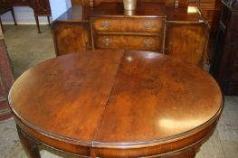 Walnut oval extending dining table and sideboard