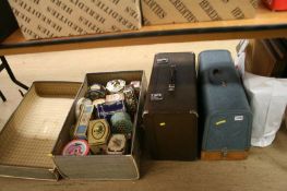 Two cased sewing machines, a travel case, tea and biscuit tins etc.